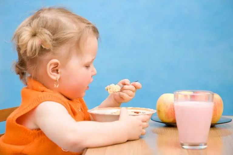 Little girl eating healthy baby food