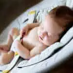 Sweet newborn baby girl sleeping at night