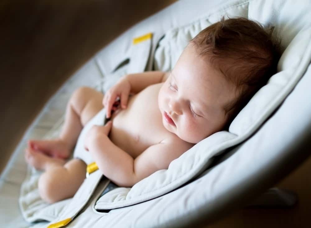 Sweet newborn baby girl sleeping at night