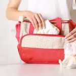 Woman cleaning her diaper bag