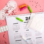 Medical female tampon on a pink background.