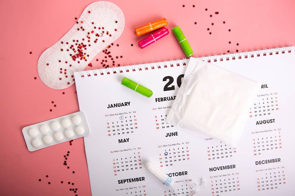 Medical female tampon on a pink background.