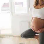 Exercising pregnant woman at home