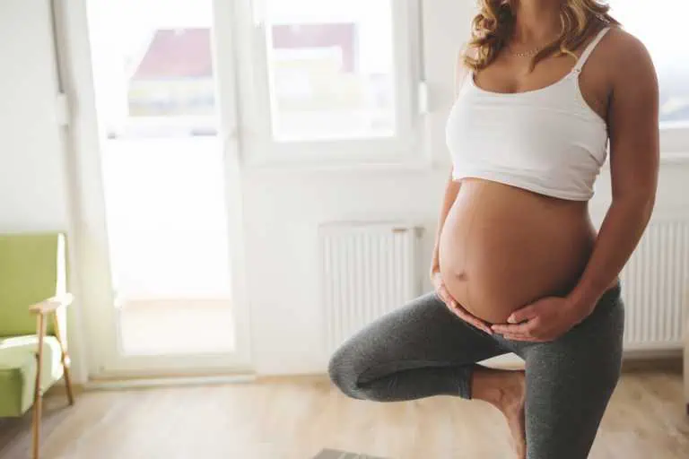 Exercising pregnant woman at home
