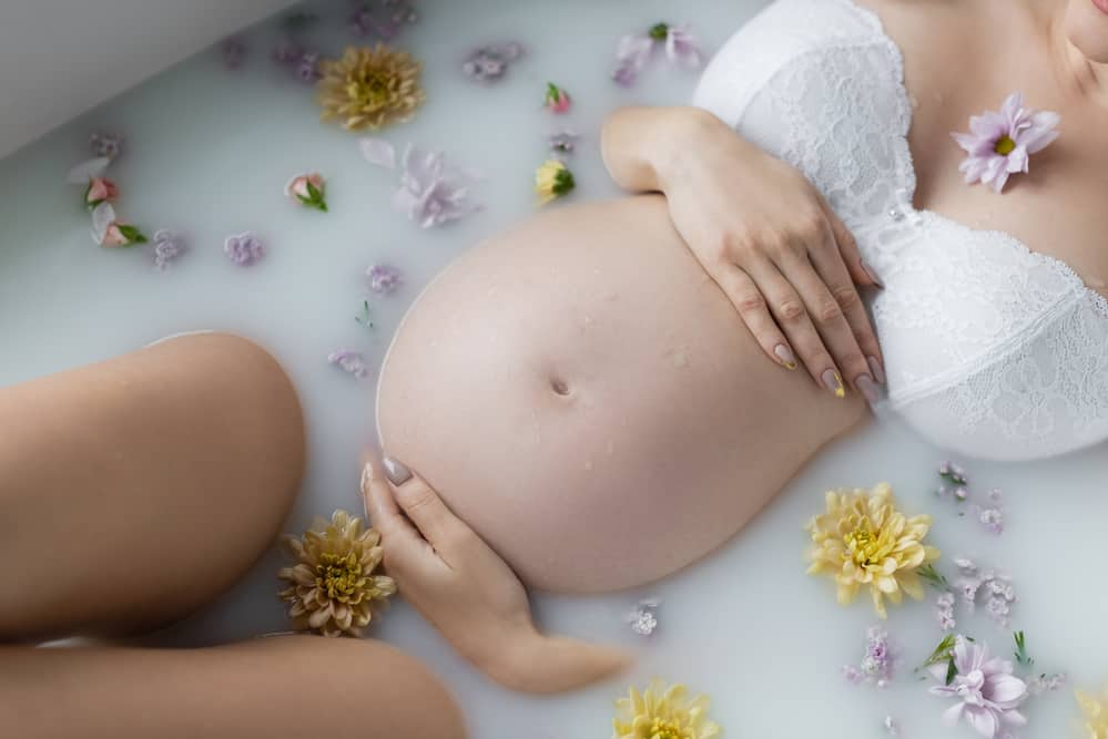 pregnant woman taking a bath