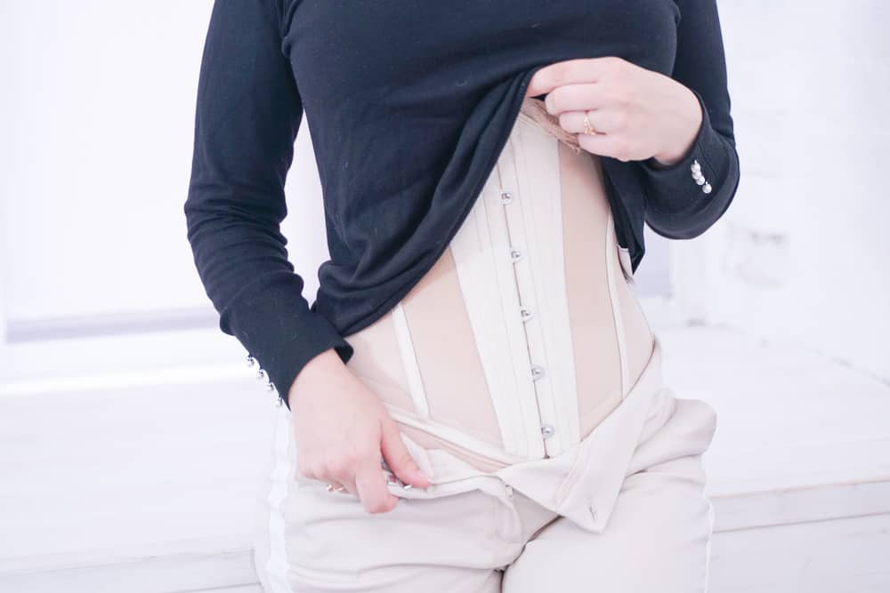 woman close up wearing a waist trainer