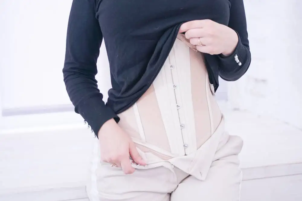 woman close up wearing a waist trainer