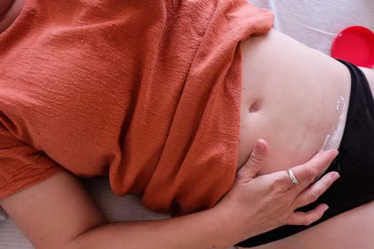 Woman cares for her cesarean incision