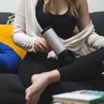 Woman using an electric massager