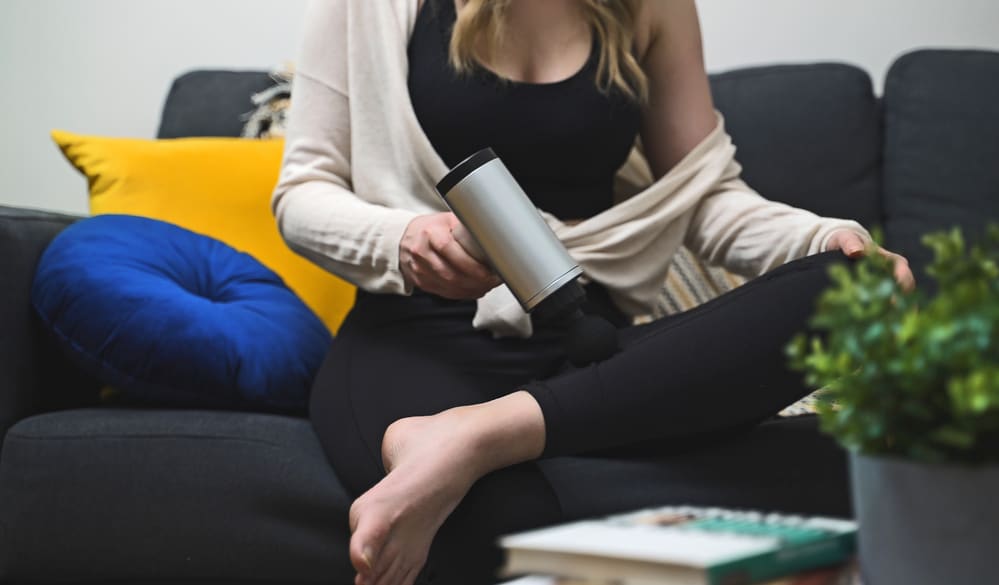 Woman using an electric massager