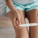 woman with positive pregnancy test